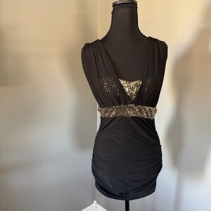 Hong Mi Fashion mini dress.  Medium black with gold bust